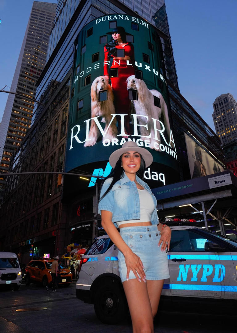 Durana Elmi in Times Square New York City for Modern Luxury Magazine cover unveiling.